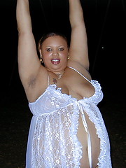 Fat chocolate woman posing outdoor