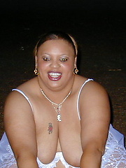 Fat chocolate woman posing outdoor