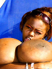 Monster tits playing with blue glass dildo